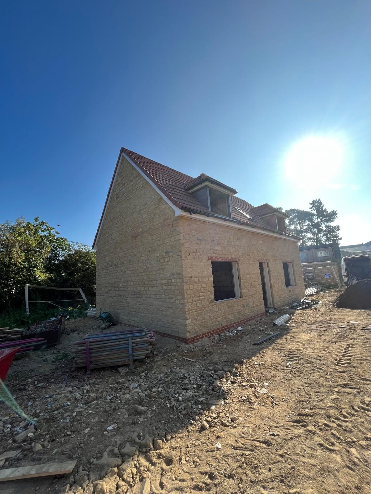 Stone New Build — 06 · Shell complete under roof